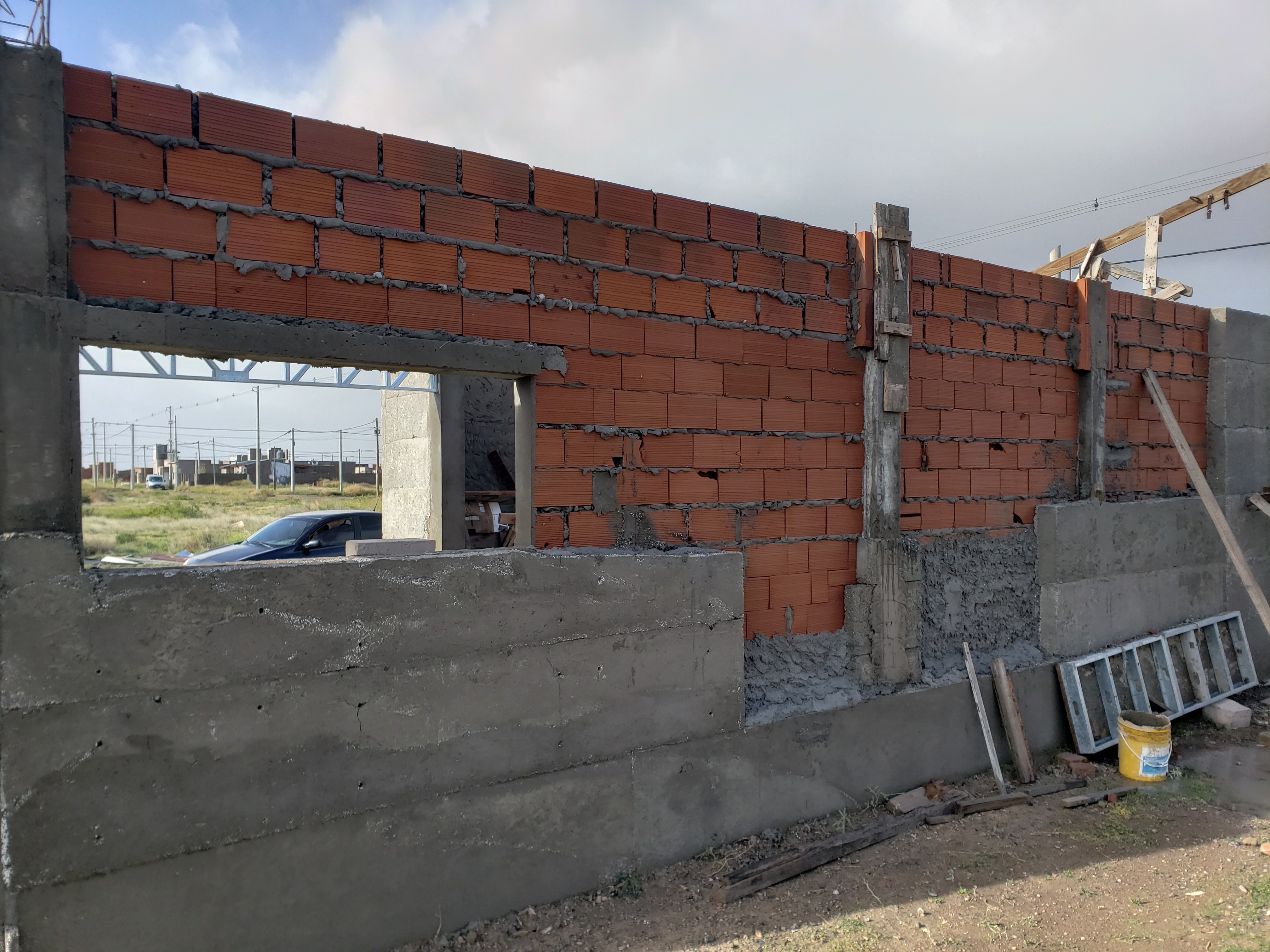 Orange bricks — the last available surface for names in Gabriel's Patagonia home